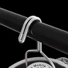 A close-up shot of a metal hook attached to a black rod, with part of a circular object visible below. Anteprima dell’immagine prodotto