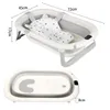 A foldable baby bathtub with a bath mat and dimensions shown. Produktbild-Vorschau