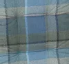 A close-up view of a plaid fabric pattern. Produktbild-Vorschau