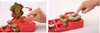 Two images showing a toy for making pins, with a hand interacting with it. Anteprima dell’immagine prodotto