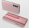 A rose gold smartphone case with a clear view flip cover is shown from two angles against a light gray background. Produktbild-Vorschau
