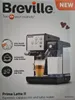 The image shows the packaging of a Breville Prima Latte II espresso, cappuccino, and latte maker. Produktbild-Vorschau