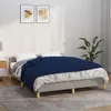 A bedroom scene with a bed made up with white sheets and a navy blue quilted blanket. Anteprima dell’immagine prodotto