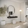 A modern hallway with a console table, mirror, plant, and floor lamp. Náhled obrázku produktu