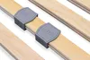 Close-up view of wooden slats with gray plastic fasteners, likely part of a bed frame or mattress support. Produktbild-Vorschau