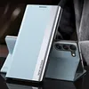 A light blue flip case for a smartphone is shown standing upright, with the back of the phone visible and propped up by the case. Anteprima dell’immagine prodotto