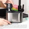 A person is using a Vileda dish soap dispenser and organizer next to a sink. Anteprima dell’immagine prodotto