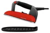 A red and gray steam iron with a black cord and a black accessory resting below it, isolated on a white background. Produktbild-Vorschau