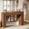 A console table with a lamp and plant in a living room setting. Anteprima dell’immagine prodotto