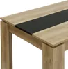 Close-up of a modern dining table with a wood-grain finish and a black inlay. Náhled obrázku produktu