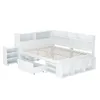 A white bed frame with a built-in bookshelf headboard and storage drawers. Produktbild-Vorschau