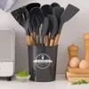 A set of kitchen utensils in a holder, with eggs and a salt shaker in the background. Náhľad obrázku produktu