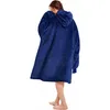 A person wearing a blue hoodie blanket. Náhled obrázku produktu