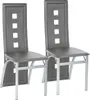 Two dining chairs shown from a front-diagonal view against a white background. Voir les images du produit