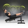 A man is performing a core exercise on an adjustable bench with his feet secured. The word 'Core' is prominently displayed in a glowing yellow font in the background. Náhled obrázku produktu