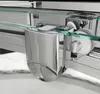 Close-up view of a shower door mechanism, showing the roller and track system. Voir les images du produit