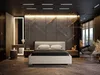 A modern bedroom with a bed, nightstand, chair, and vanity. Produktbild-Vorschau