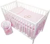 A baby crib with bedding and a sleeping bag. Produktbild-Vorschau