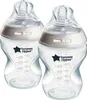 Two clear baby bottles with gray collars and clear nipples are shown against a white background. Voir les images du produit