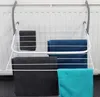 A white metal drying rack with several towels hanging on it, attached to a white radiator. Produktbild-Vorschau