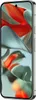 A close-up, angled view of a smartphone with a colorful abstract wallpaper on its screen. Náhľad obrázku produktu