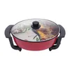 A red electric hot pot with a glass lid, divided into two sections, filled with food. Podgląd zdjęcia produktu