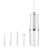 A white and clear portable wireless water flosser with multiple attachments is displayed against a white background. Náhľad obrázku produktu
