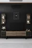 A modern living room setup featuring a TV stand with a television, wall shelves, and a clock. Anteprima dell’immagine prodotto