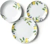 Three white plates with a lemon and leaf pattern are arranged on a white background. Anteprima dell’immagine prodotto
