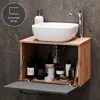 A bathroom vanity with a vessel sink and storage cabinet. Produktbild-Vorschau