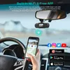 A person's hand holding a smartphone inside a car, with a dashcam mounted on the rearview mirror. Produktbild-Vorschau