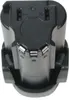 A close-up, top-down view of a black battery pack and charger base. Produktbild-Vorschau