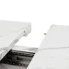 Close-up of a white marble table top extending on metal slides. Anteprima dell’immagine prodotto