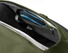 Close-up view of the interior of a green backpack, showing a zippered pocket with a blue pouch and a key clip. Produktbild-Vorschau