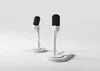 Two modern microphones on white stands against a white background. Náhled obrázku produktu