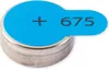A close-up shot of a single button cell battery with a blue label. Náhled obrázku produktu