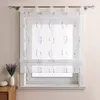 A transparent curtain with a decorative pattern hangs over a window. Produktbild-Vorschau