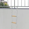 A rope ladder is hanging from a balcony railing, with the wall of the building in the background. Náhled obrázku produktu