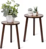 Two wooden plant stands with potted plants on them, against a white background. Náhled obrázku produktu