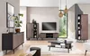 A modern living room with a 5-piece furniture set, including a sideboard, display cabinet, TV stand, and coffee table, arranged around a television. Produktbild-Vorschau