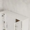 A close-up view of a white bathroom cabinet with mirrored doors, set against a light gray tiled wall. Náhled obrázku produktu