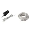 A black power adapter and a coiled string of white LED lights on a white background. Produktbild-Vorschau