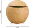 A product shot of a wooden-textured aroma diffuser and humidifier. Náhled obrázku produktu