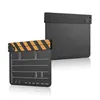 Two black film clapperboards are shown against a white background. One is in the foreground, open, with yellow and black stripes on the clapper. The other is in the background, closed. Náhled obrázku produktu