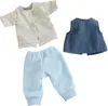 A set of doll clothes, including a jacket, vest, and pants, laid out on a white background. Produktbild-Vorschau