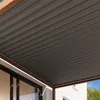 A close-up view of a modern pergola roof structure attached to a building. Náhled obrázku produktu