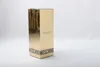 A gold-colored perfume box with black text. Produktbild-Vorschau