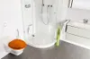 A modern bathroom with a toilet, shower, and vanity. Produktbild-Vorschau