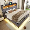 A bedroom scene featuring a modern upholstered bed with integrated storage and LED lighting. Produktbild-Vorschau