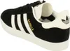 A side view of a black Adidas Gazelle sneaker with white stripes and accents. Produktbild-Vorschau